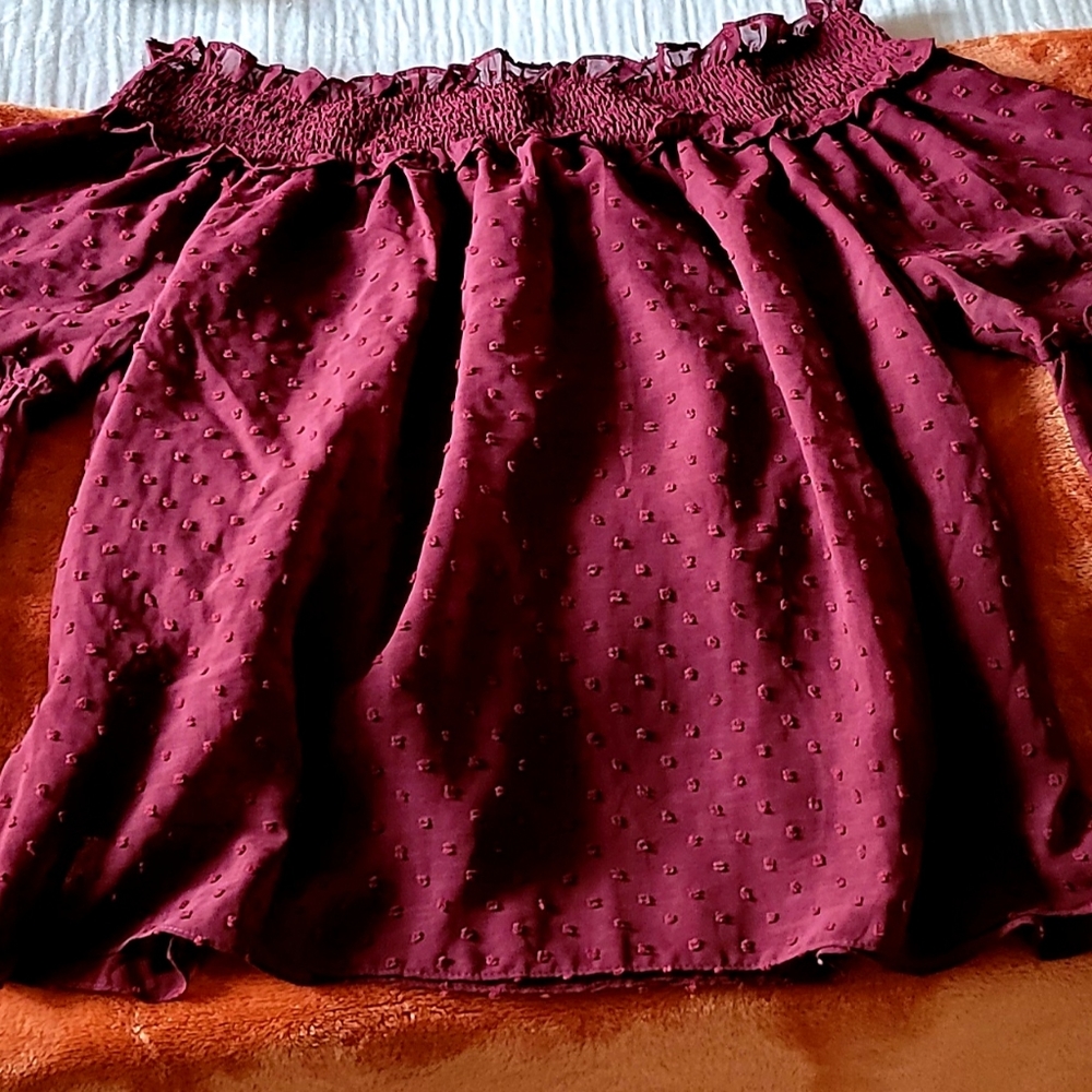 Wine off the shoulder shirt.
